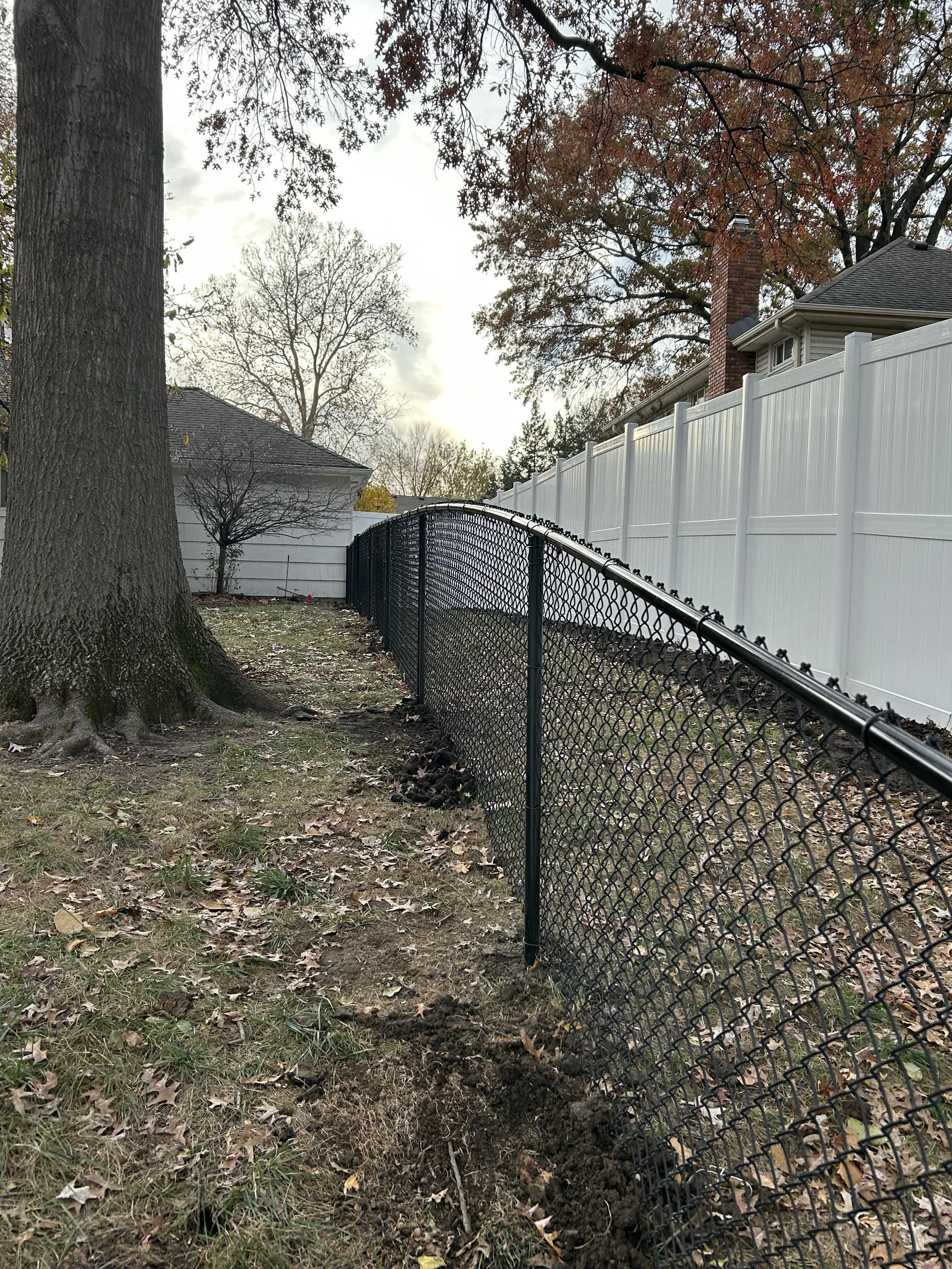 Beautiful backyard fence installed by Integrity Construction KC